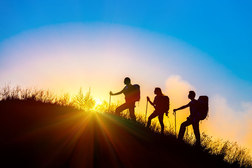 Group hiking at sunrise