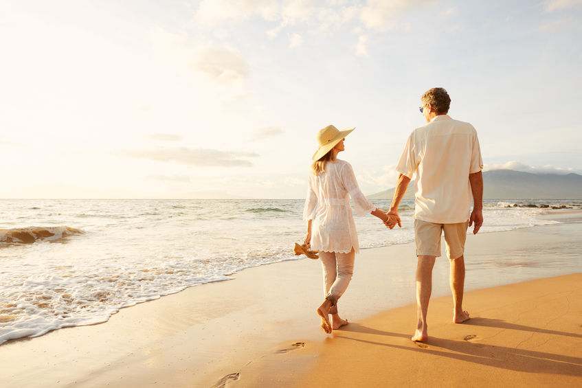 Happy Romantic Middle Aged Couple Enjoying Beautiful Sunset Walk on the Beach
